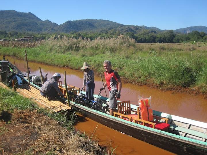 Loading our bike onto the Longboat for our trip to the Northern end of Inle Lake.