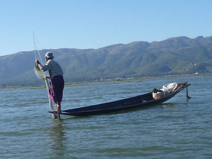 Another shot of a fisherman in his flat bottomed canoe