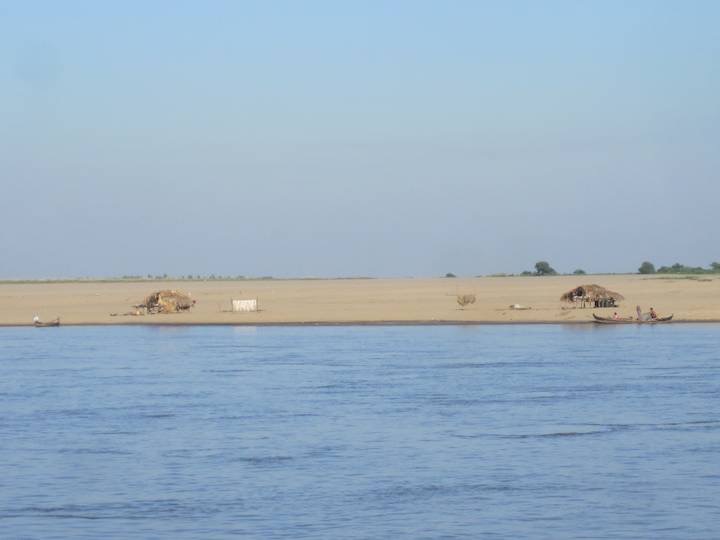 Home by the riverside for fisherman.  We also saw many bullock drawn plows working the fields