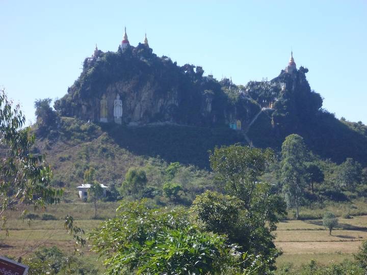 A pair of giant standing buddha take up half a small mountain.