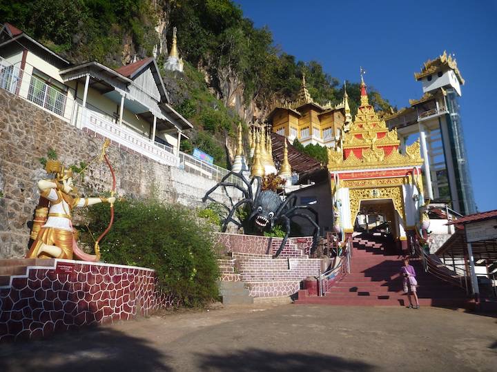 At the entrance to the cave pagoda, Pindaya&rsquo;s symbol of an archer shooting a spider.